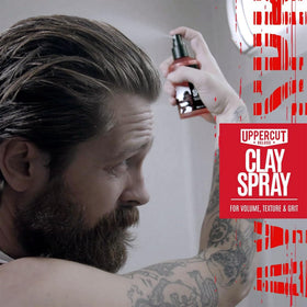 UPPERCUT DELUXE being sprayed into hand to demonstrate controlled, targeted use benefit