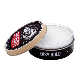 Uppercut Deluxe pomade being scooped in hands for effortless application