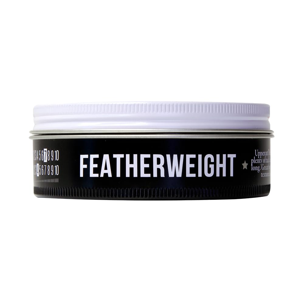 UPPERCUT DELUXE hands applying pomade demonstrating smooth spreadability benefit