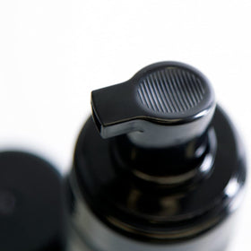 UPPERCUT DELUXE applying foam to damp hair showing even distribution benefit