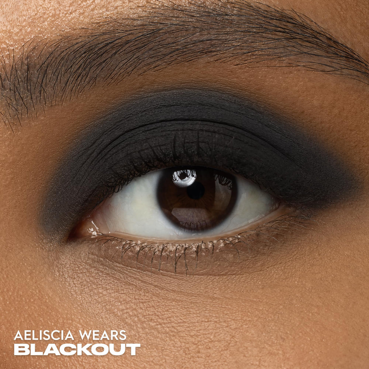 URBAN DECAY swatch of Blackout on skin showing intense payoff and deep matte finish