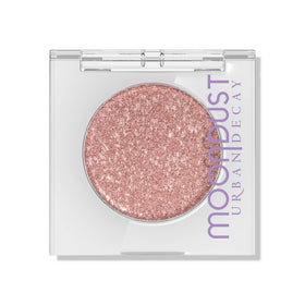 Urban Decay Crushin' Hard front pan showing peach pink shimmer and easy pickup