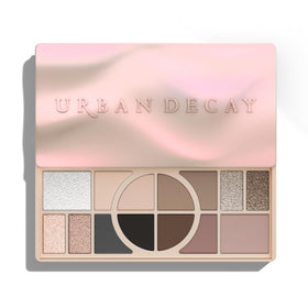 Urban Decay palette front open showing 14 cool-toned pans and multiuse layout benefits