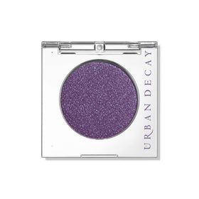 Urban Decay front compact showing deep purple shimmer for bold color payoff