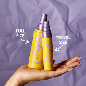 Urban Decay travel bottle next to full-size showing portable convenience and long wear