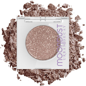 Urban Decay Space Cowboy front pan showing champagne-silver sparkle for intense shine