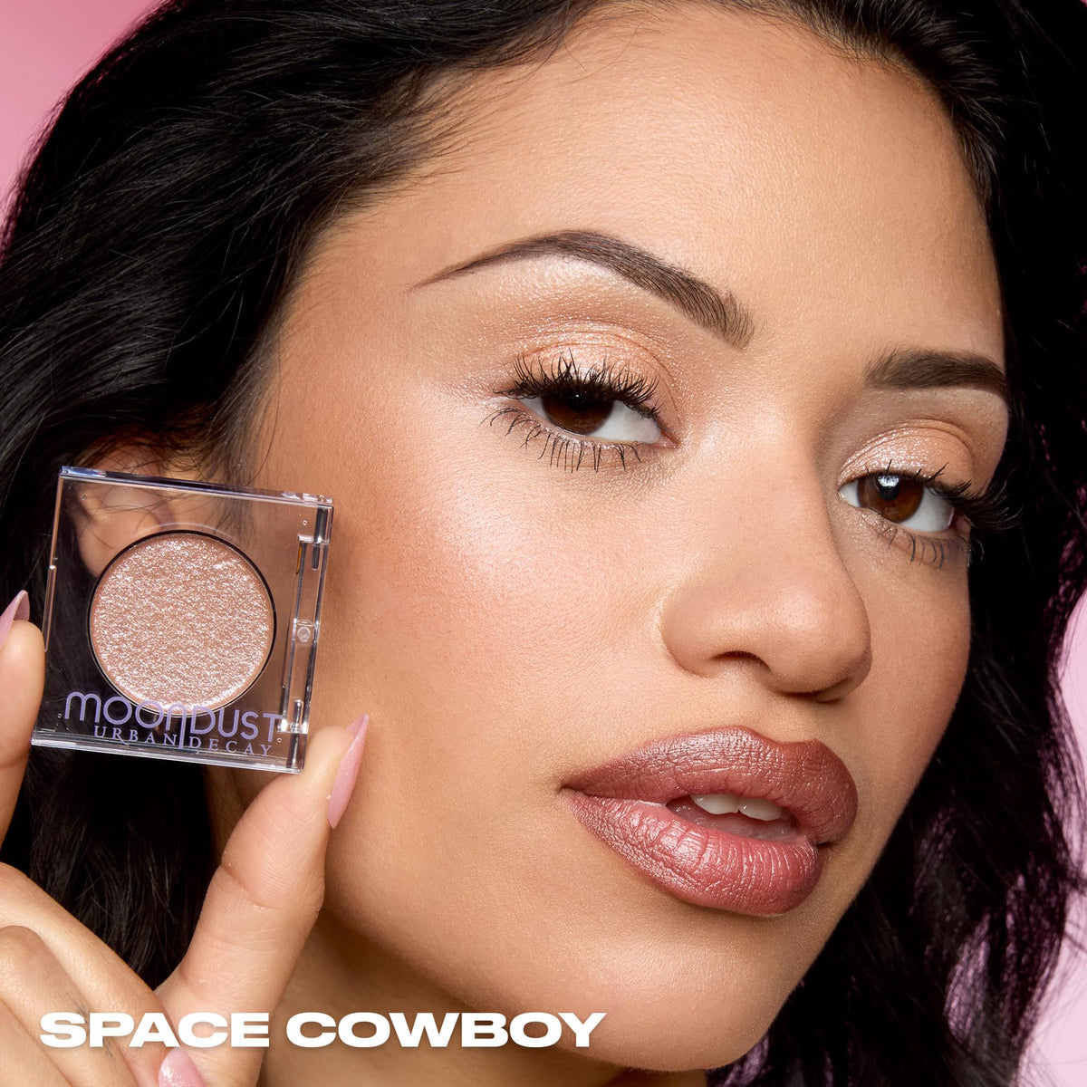 Urban Decay model wearing Space Cowboy for glamorous daytime-to-night sparkle