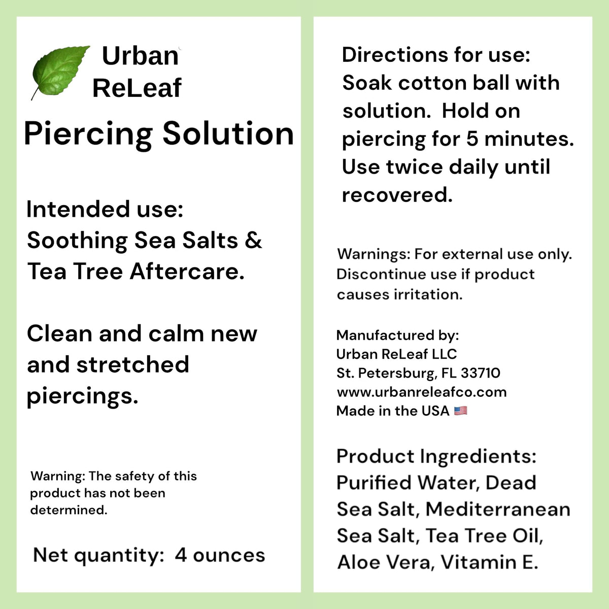 Urban ReLeaf aloe leaf and tea tree sprig beside bottle, showing soothing botanicals
