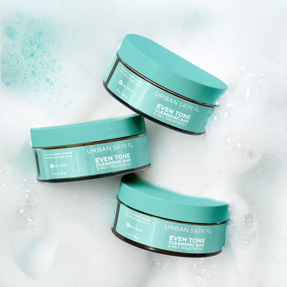 Urban Skin Rx bar next to a coin showing compact 2.0 oz size and travel-friendly benefit