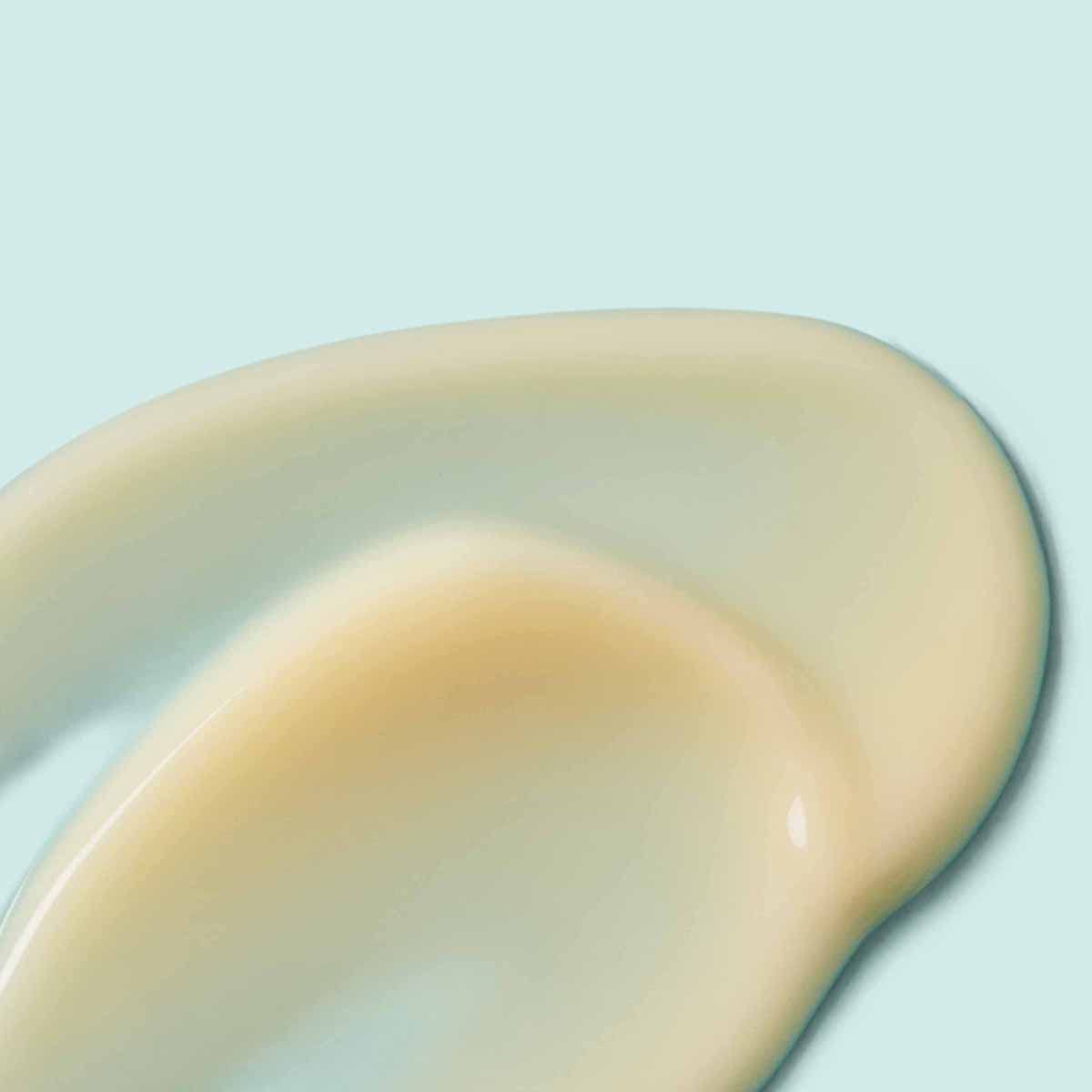 Urban Skin Rx bottle in hand size comparison, conveys one-fluid-ounce portability benefit