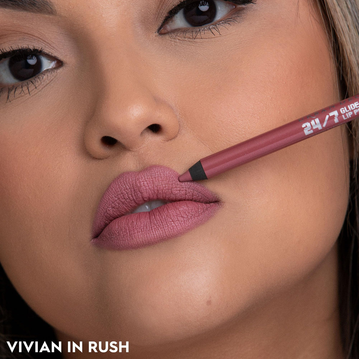 URBAN DECAY application on lips in natural light, defines shape and prevents feathering