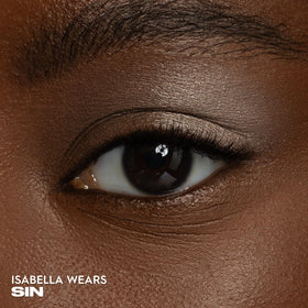URBAN DECAY sin texture swipe on skin demonstrating creamy, blendable payoff