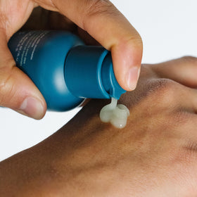 Ursa Major clear serum drop texture showing lightweight hydration and quick absorption