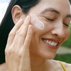 Ursa Major serum being pressed into skin demonstrating fast absorption and non-greasy finish