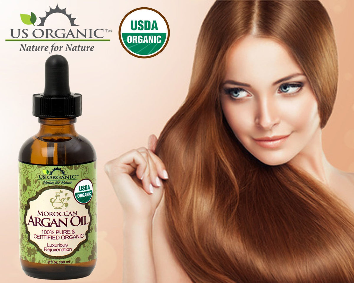US Organic applying oil to hands and face for moisturized and smoother skin