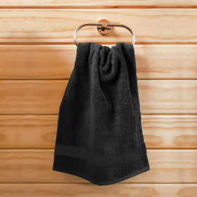 Utopia Towels laid in a spa setting showing black towels enhancing professional look benefit