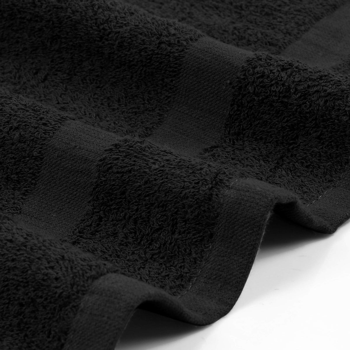 Utopia Towels in use by stylist drying hair demonstrating practical salon performance benefit