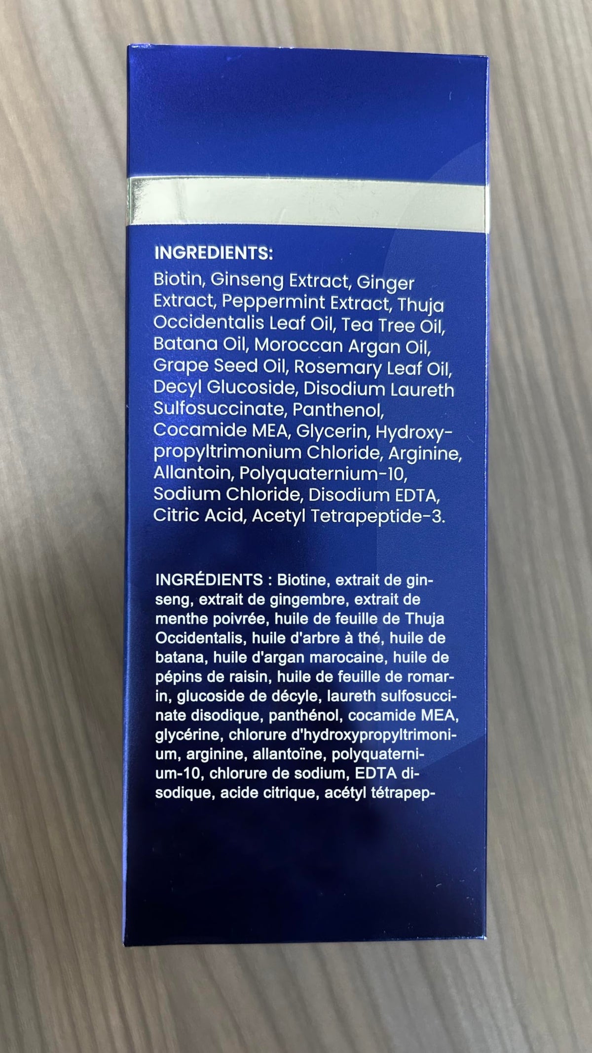 Fresh rosemary, tea tree and ginseng ingredients beside Uttse bottle signalling botanical blend