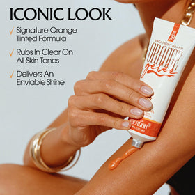 VACATION applied on forearm displaying clear glossy sheen benefit