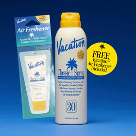 VACATION sunscreen in hand showing compact 6 fl oz travel-friendly size