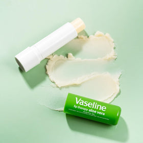 Vaseline Aloe Fresh stick in hand demonstrating compact travel-friendly size