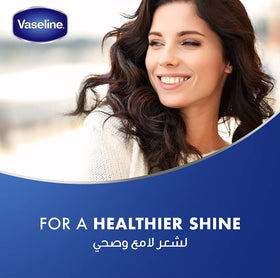 Vaseline 100ml bottle beside ruler demonstrating compact travel size