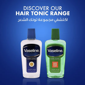 Hand applying Vaseline tonic to scalp to restore natural oils