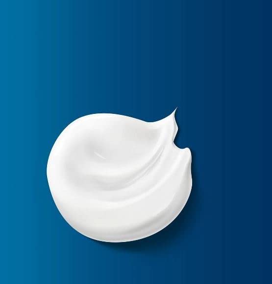Close-up of Vaseline lotion texture demonstrating smooth absorption