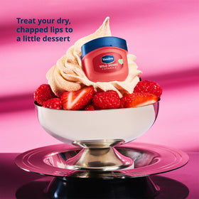 Vaseline Wild Berry applied on lips showing glossy tint and quick moisture benefit