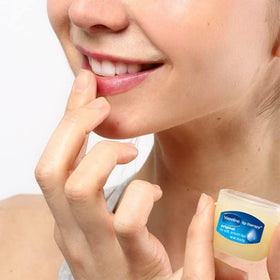 Top view of open Vaseline jar showing clean white petrolatum protective layer