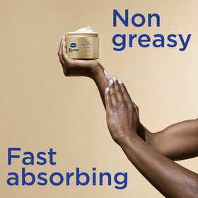 Vaseline Radiant X cream in hand being applied to skin demonstrating quick absorption and non-greasy feel