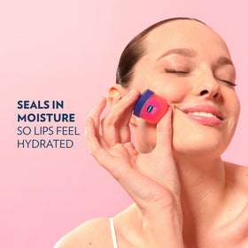 Vaseline Rosy Lips placed with travel essentials for on-the-go hydration