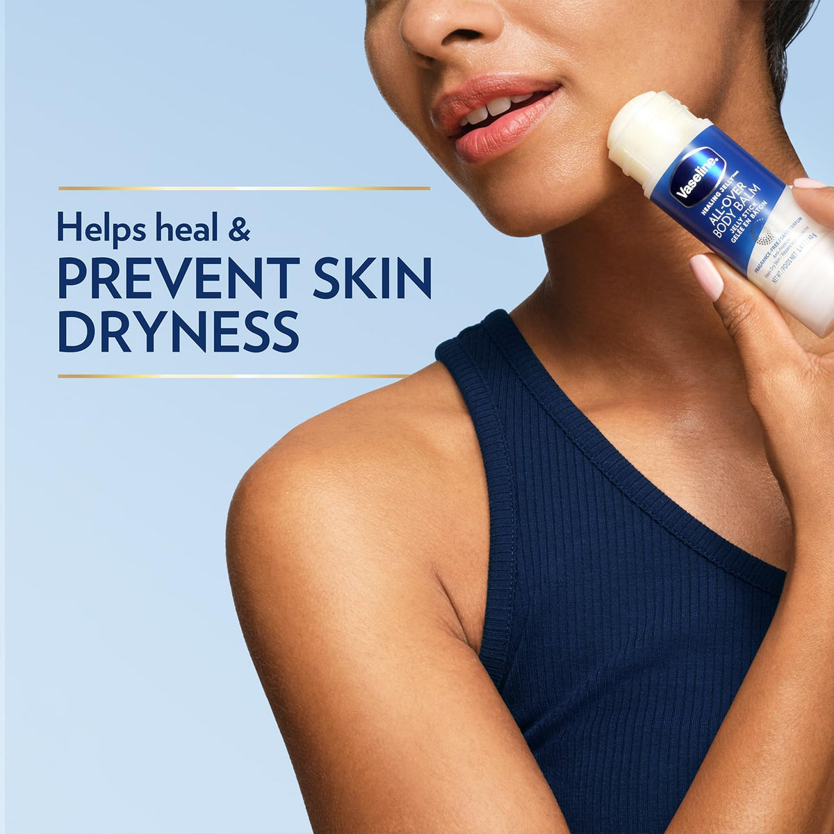 Vaseline stick next to a hand demonstrates convenient size