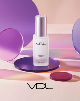 VDL primer on model cheek showing natural highlight and camera-ready radiance benefit