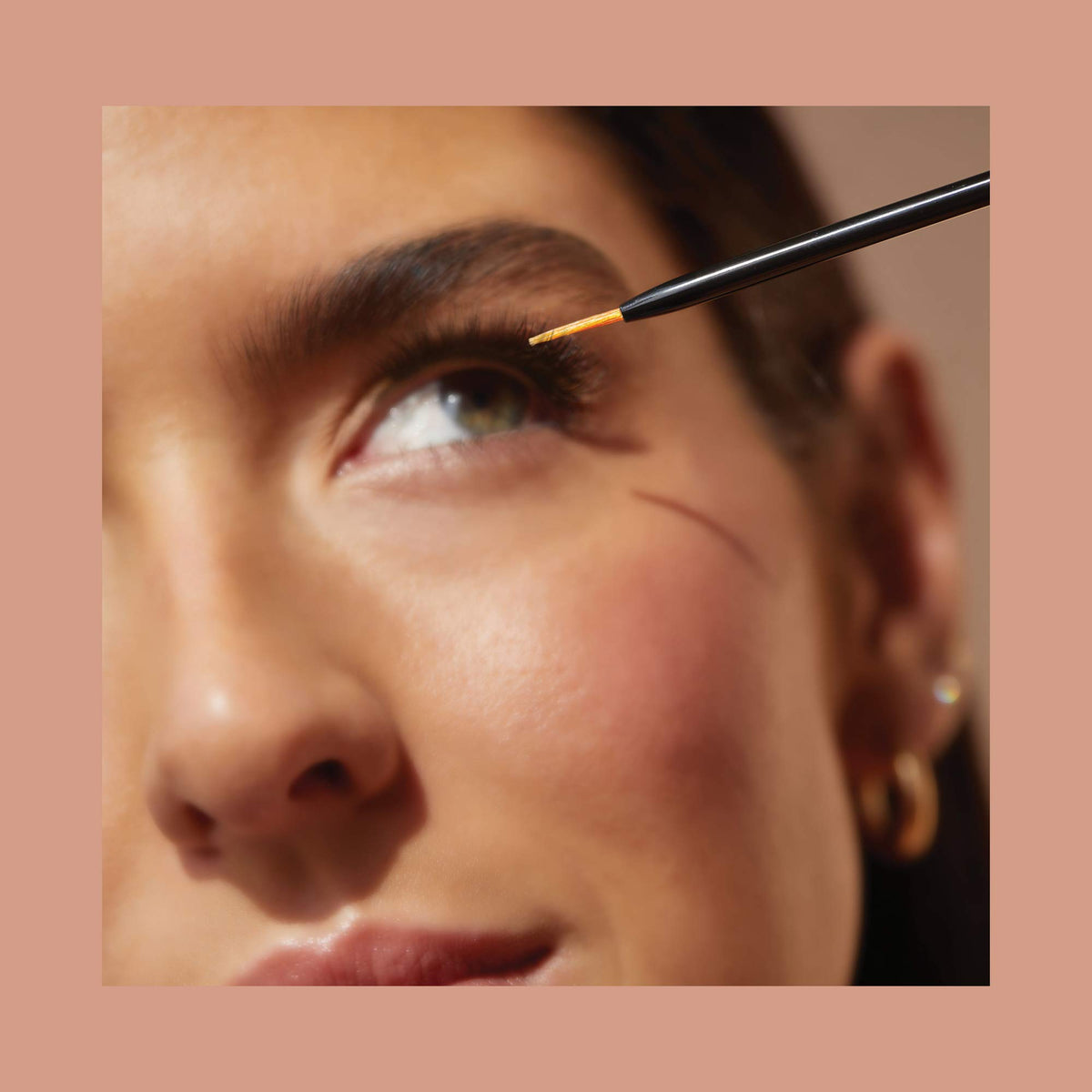 VEGAMOUR GRO Lash Serum being applied to upper lash line for improved density