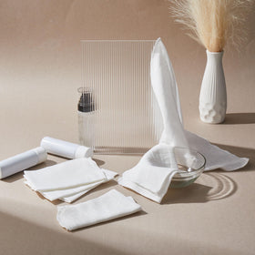 Velmitten cloths styled in a bathroom setting to show tidy skincare routine benefit