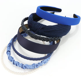 VELSCRUN front packaging showing seven navy headbands and benefits