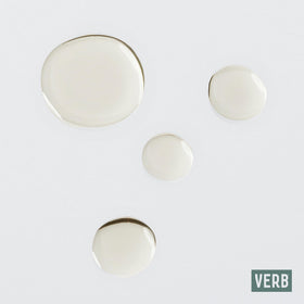 VERB curl oil applied to curly hair mid-lengths enhancing definition and softness