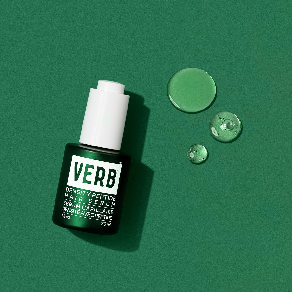 VERB Density Peptide Serum held in hand for size comparison and easy everyday use portability