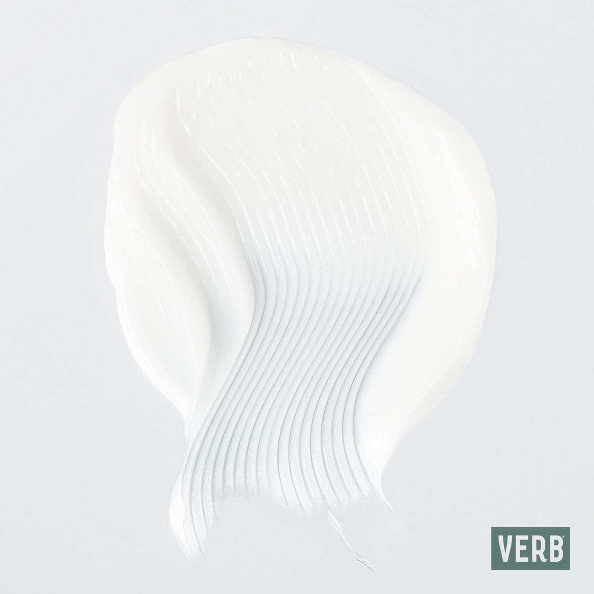 VERB Ghost conditioner held in hand to show 12 fl oz scale and travel convenience