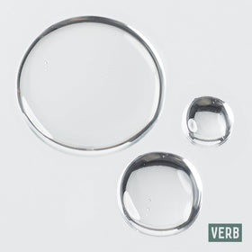 VERB smoothing oil onto ends to reduce breakage and tame flyaways