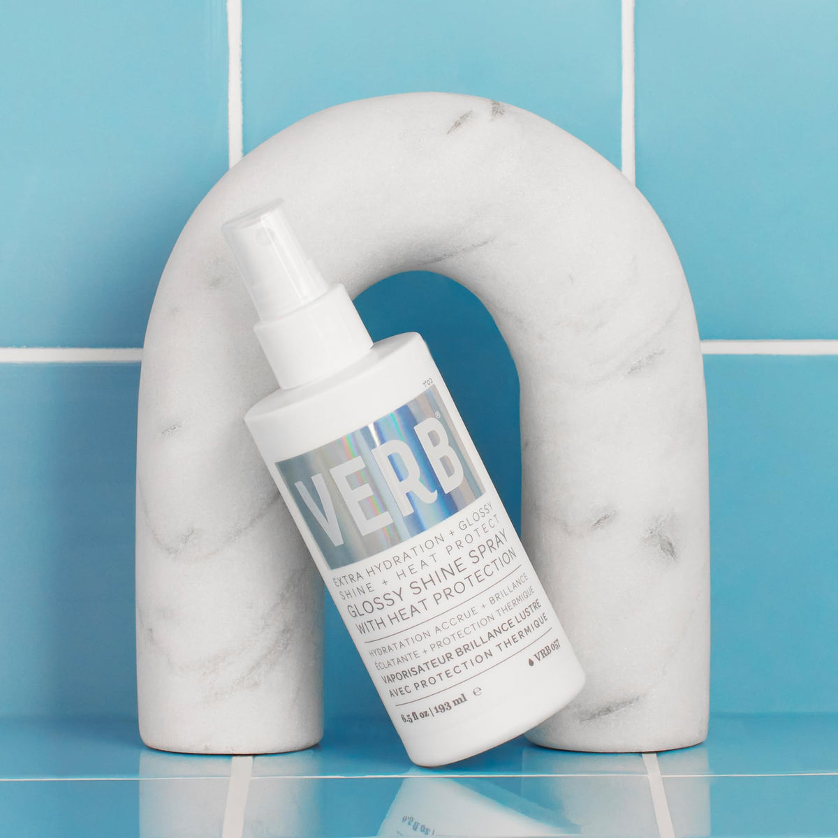 VERB bottle in hand to show 2 fl oz scale and travel-friendly convenience