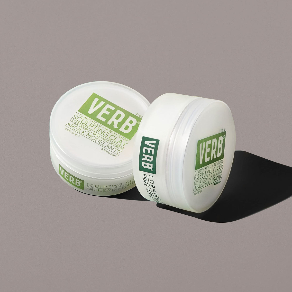 Verb applying clay to damp hair for sleek, structured styling benefit