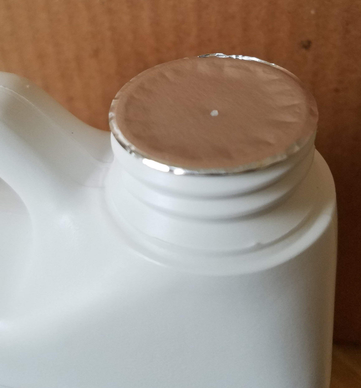 Verdana neem oil diluted in spray bottle being applied to plant foliage safely