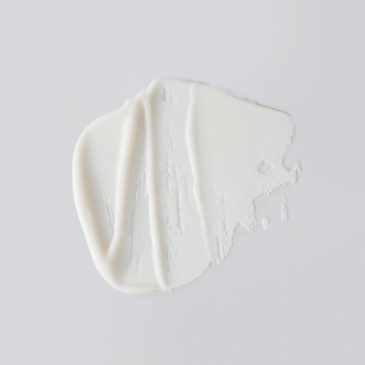 Versed creamy texture close-up illustrating smooth formula and gentle exfoliating finish