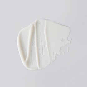Versed creamy texture close-up illustrating smooth formula and gentle exfoliating finish