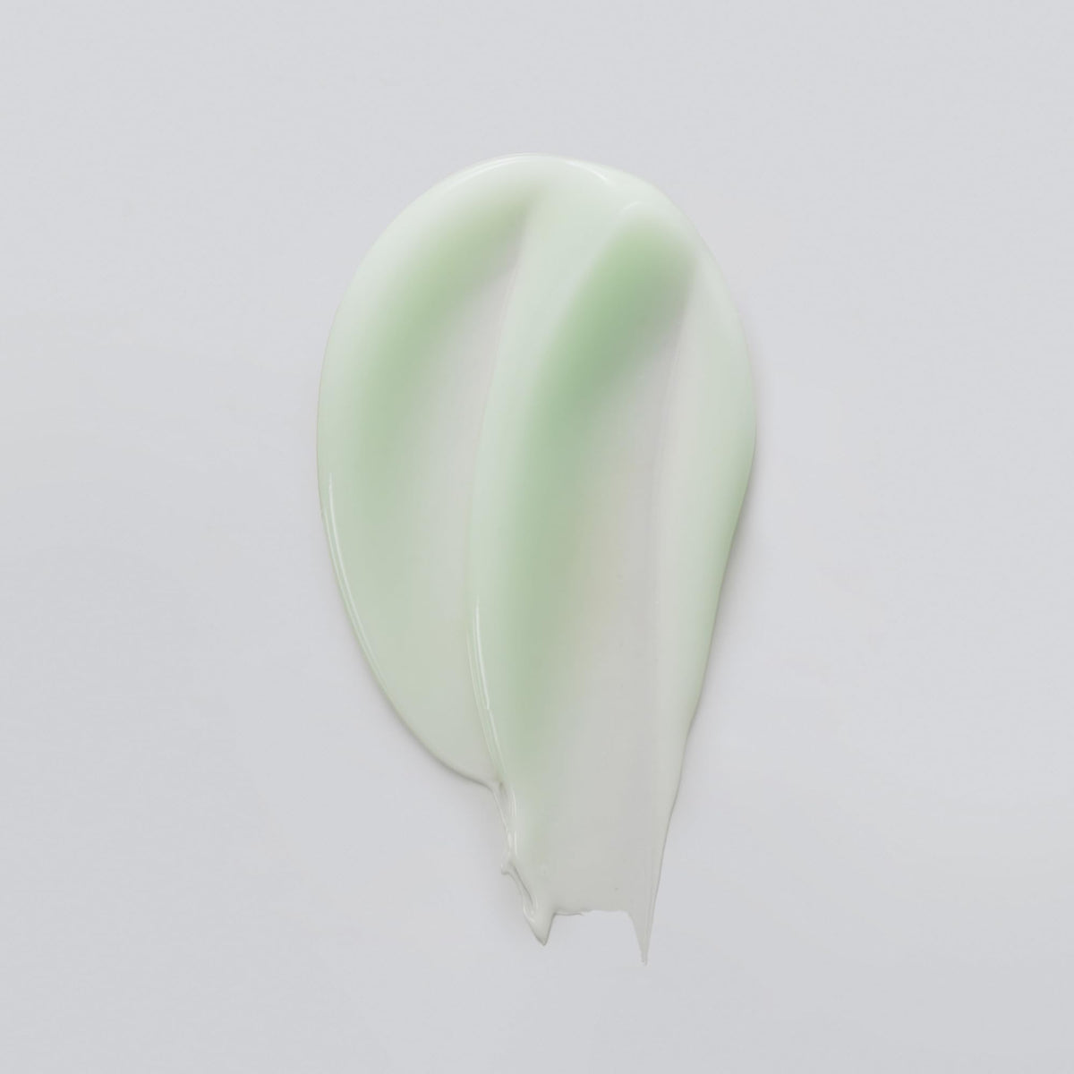 Versed creamy serum texture on fingertip demonstrating fast absorption benefit