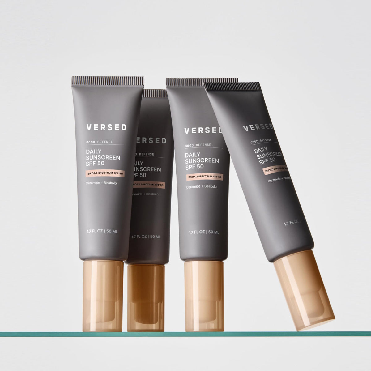 Versed 1.7 oz tube next to hand for clear size and travel-friendly benefit