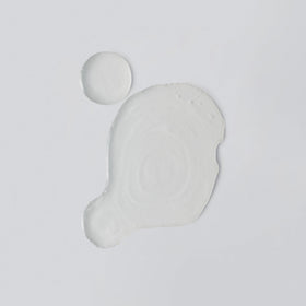 Versed milky texture close-up illustrating fast-absorbing hydration benefit