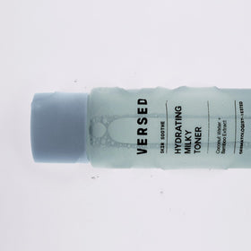 Versed bottle next to coin showing 4 fl oz size and travel-friendly benefit